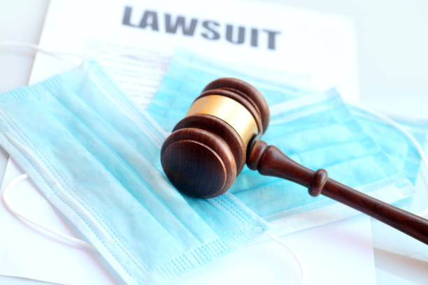 Covid face masks and gavel Concept for covid-19 related lawsuits lawsuit photos stock pictures, royalty-free photos & images