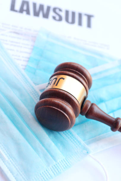 istock Covid face masks and gavel 1221613952