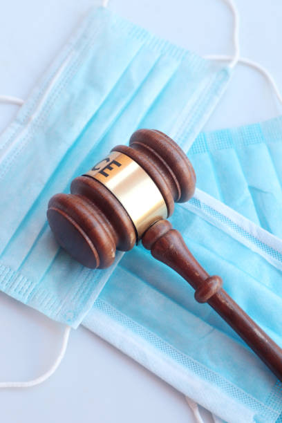 istock Covid face masks and gavel 1221614467