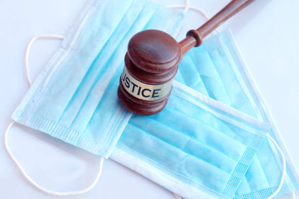 istock Covid face masks and gavel 1221614468