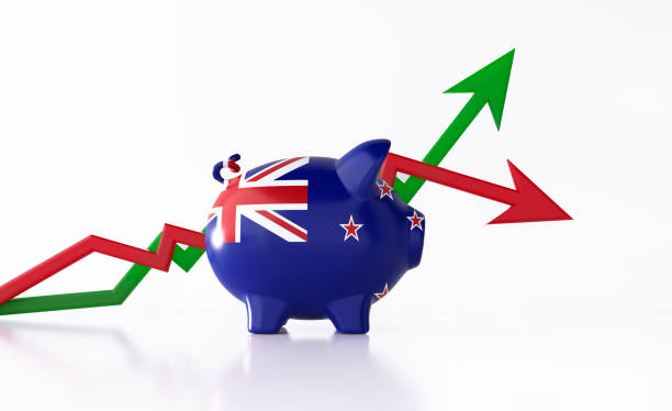 Piggy Bank Textured with New Zealand Flag Sitting in Front of Red and Green Arrows on White Background Piggy bank textured with New Zealand flag sitting in front of red and green arrows on white background. Horizontal composition with copy space. Clipping path is included. Great use for savings concepts. central bank stock pictures, royalty-free photos & images