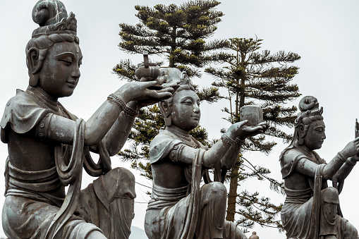 Devas Worship Giant Buddha at Hong Kong Temple. They are three of the Six Devas outside the Giant Buddha, Lantau Island.