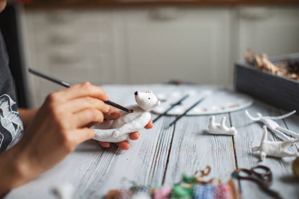 istock Woman making wool soft toys 1221615906
