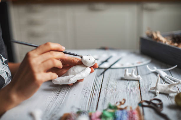 istock Woman making wool soft toys 1221615932