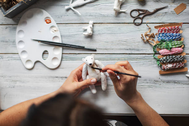 istock Woman making wool soft toys 1221615978