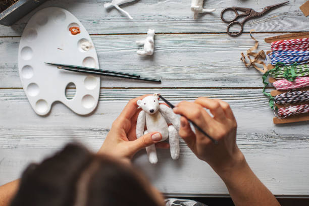 istock Woman making wool soft toys 1221615985