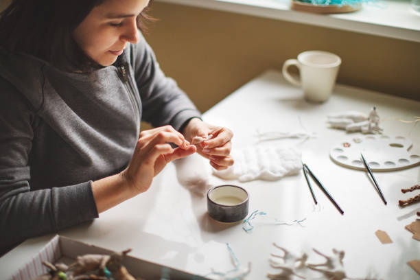 istock Woman making wool soft toys 1221616539