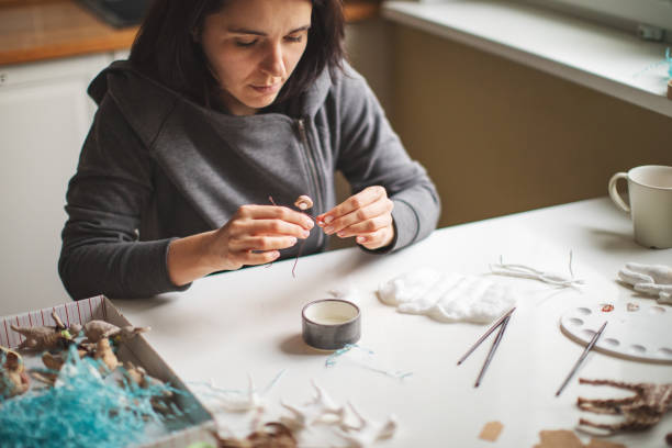 istock Woman making wool soft toys 1221616540