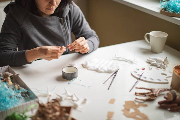 istock Woman making wool soft toys 1221616564
