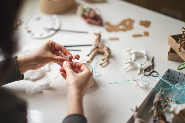 istock Woman making wool soft toys 1221616618