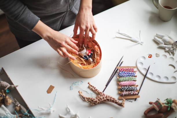 istock Woman making wool soft toys 1221617136