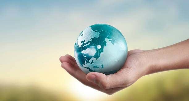 istock Globe ,earth in hand, holding our planet glowing. Earth image provided by Nasa 1221617173