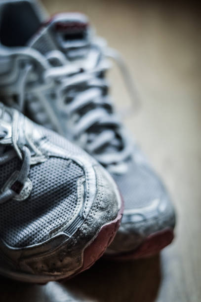 istock Old dirty sneakers close up, selective focus, desaturated colors. 1221617891