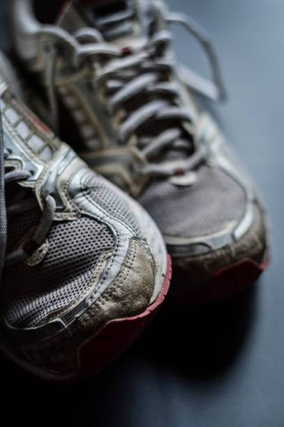 istock Old dirty sneakers close up, selective focus, desaturated colors. 1221618321