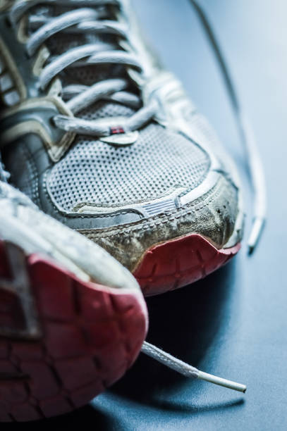 istock Old dirty sneakers close up, selective focus, desaturated colors. 1221618459
