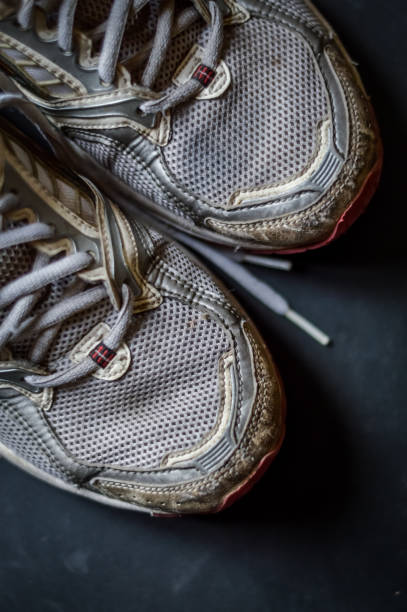 istock Old dirty sneakers close up, selective focus, desaturated colors. 1221618700