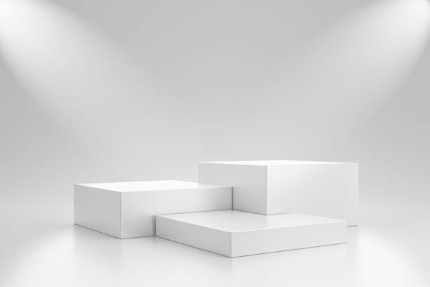 istock White studio template and cube pedestal on simple background with spotlight product shelf. Blank studio podium for advertising. 3D rendering. 1221621299