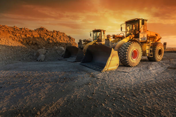 istock Two excavators moving stone and rock in a quarry 1221622586