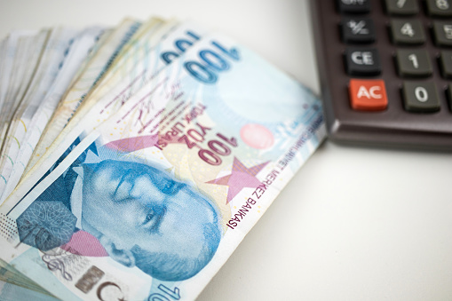 Turkish Liras Over The Calculator. Horizontal composition with copy space. Finance Concept.
