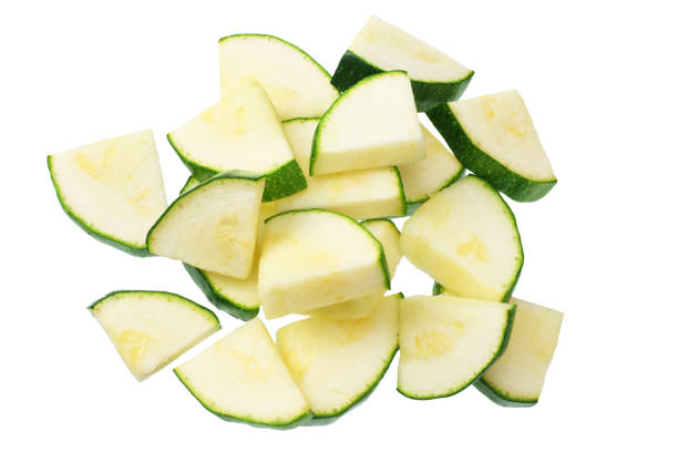 istock fresh green zucchini slices isolated on white background. top view 1221623183