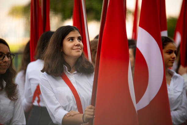 Turish flags and young female students students Izmir, Turkey - October 29, 2016. Red Turkish flags and young female students holding them at ceremony Cumhuriyet Square Alsancak , Izmir. In Republic Day of Turkey Country. number 23 stock pictures, royalty-free photos & images