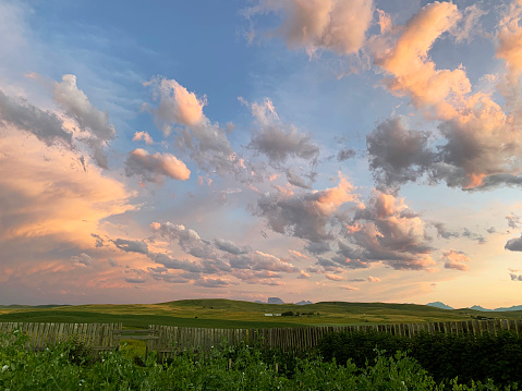 Scenic southern Alberta prairie sunset , with distant view of Chief Mountain near Cardston.