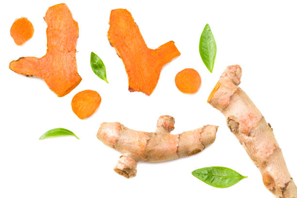istock Turmeric root with turmeric slices isolated on white background. Top view. 1221623790