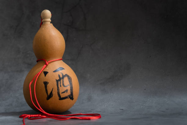 Dried bottle gourd on black background view,the chinese means is wine Dried bottle gourd on black background,the chinese means is wine chinese gourd stock pictures, royalty-free photos & images