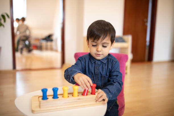istock Boys playing with educational toy in daycare classroom 1221625618