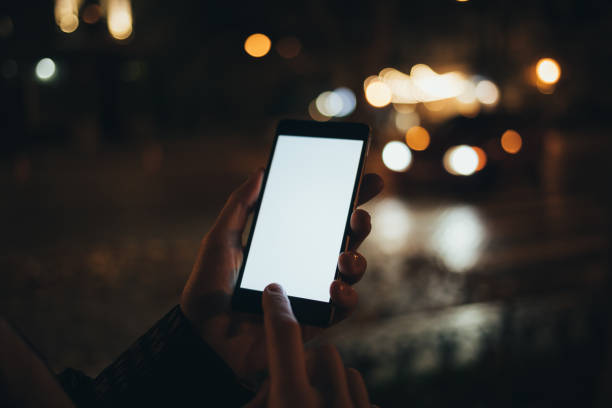 istock Young woman touching white screen smart phone 1221625663
