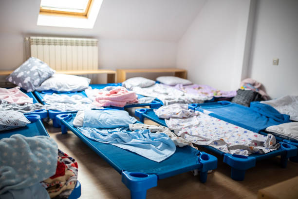 istock Empty bedroom with small beds at day care 1221625672