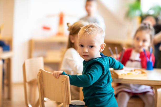 istock Curious boy in day care classroom 1221626102