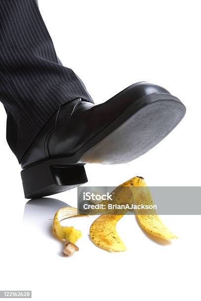 Falling On A Banana Skin Stock Photo - Download Image Now - Banana Peel, Danger, Sliding