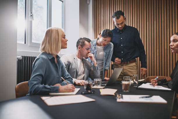 istock Businesspeople working on a laptop during a boardroom meeting 1221626995