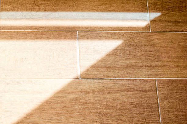 istock Organic drop shadows, geometric shadows on the floor. Floor tiles with wood structure design. Tile close-up pattern. Wood texture. Wood texture for design and decoration. 1221627019