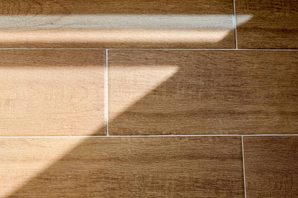 istock Organic drop shadows, geometric shadows on the floor. Floor tiles with wood structure design. Tile close-up pattern. Wood texture. Wood texture for design and decoration. 1221627020
