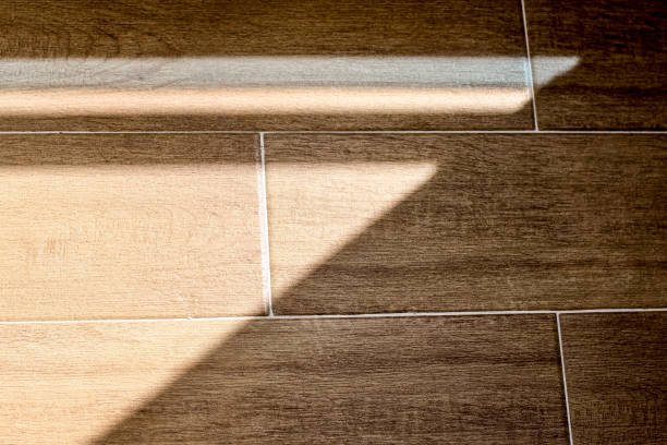istock Organic drop shadows, geometric shadows on the floor. Floor tiles with wood structure design. Tile close-up pattern. Wood texture. Wood texture for design and decoration. 1221627031