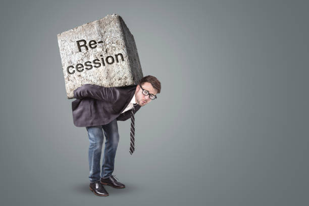 istock Businessman burdened by recession 1221627035