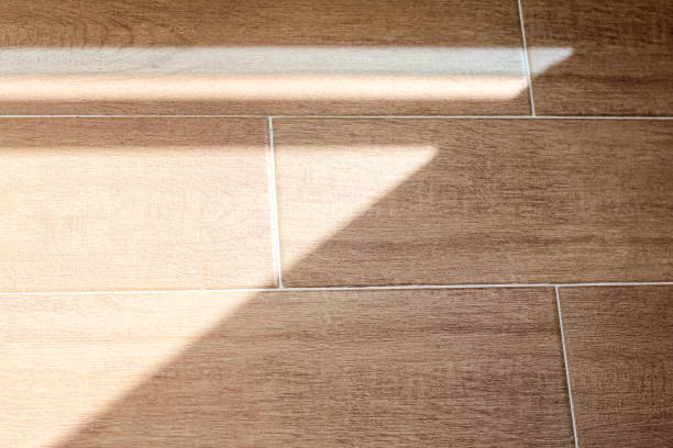 istock Organic drop shadows, geometric shadows on the floor. Floor tiles with wood structure design. Tile close-up pattern. Wood texture. Wood texture for design and decoration. 1221627038