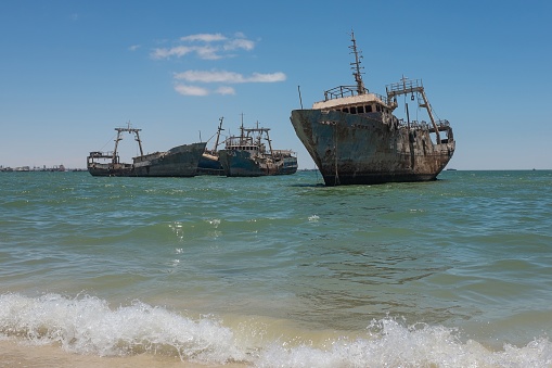 Illegal ship graveyard of scrapped fishing trawlers