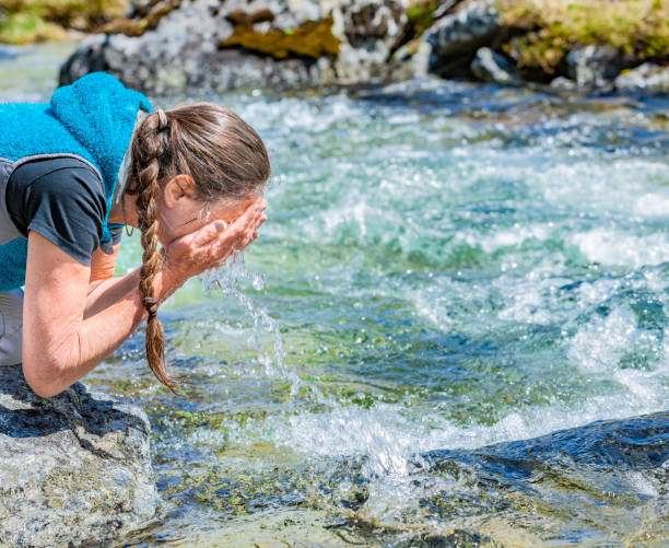 istock Washing Hands and face  in Clear Water 1221627439