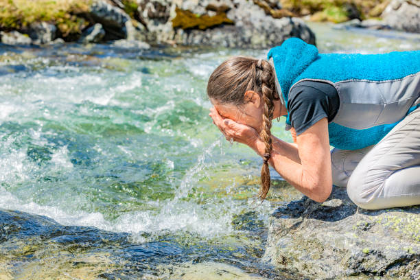istock Washing Hands and face  in Clear Water 1221627453