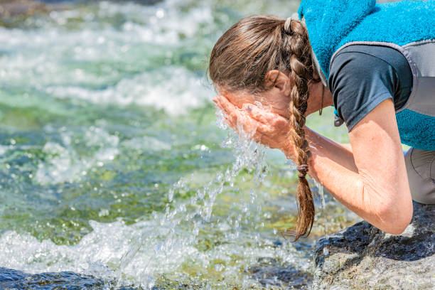 istock Washing Hands and face  in Clear Water 1221627469