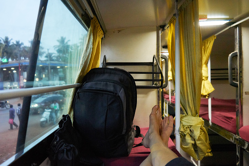 Interior of sleeper bus for tourists and other passengers. Night bus in India. Transport in India. Bus from Goa to Hampi. India.