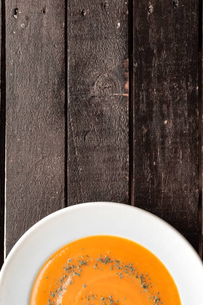 istock FLAT LAY PUMPKIN SOUP ON WOODEN BACKGROUND 1221628916