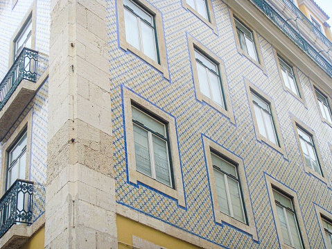 In August 2011, people from Lisbon were living in traditional buildings covered with Azulejos, Portugal.