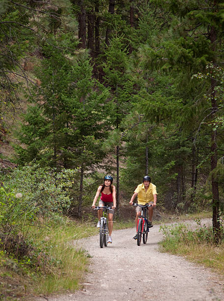 istock Couple Cycling on Forest Trail 122163370