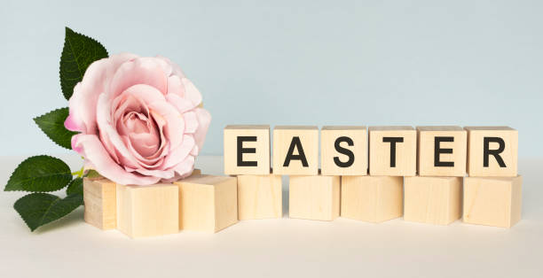 happy easter. child painting easter eggs. preparing for easter. on the table lay the cubes with the words easter. the view from the top. - easter text single word paint imagens e fotografias de stock