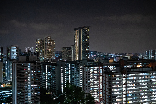 Singapore: Urban cityscape with residential buildings in Singapore at night.