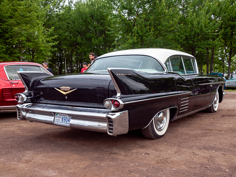 Moncton, New Brunswick, Canada - July 10, 2010 : Rear view of 1958 Cadillac Series 62 four door hard top at Annual Atlantic Nationals Automotive Extravaganza after a light rain in Centennial Park, Moncton, New Brunswick, Canada.